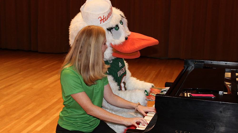 Sebastian and student playing the piano