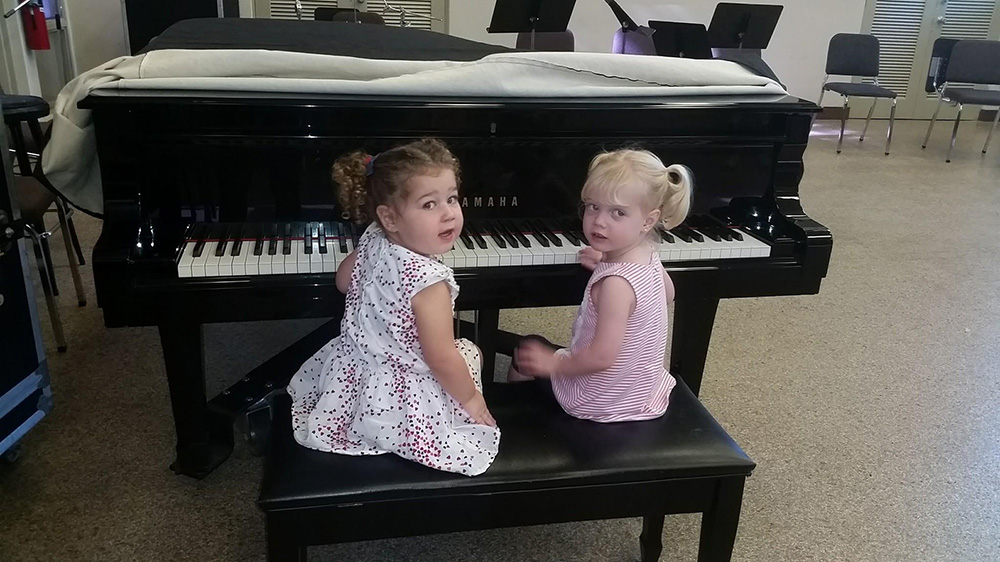 little canes enjoying time at the piano